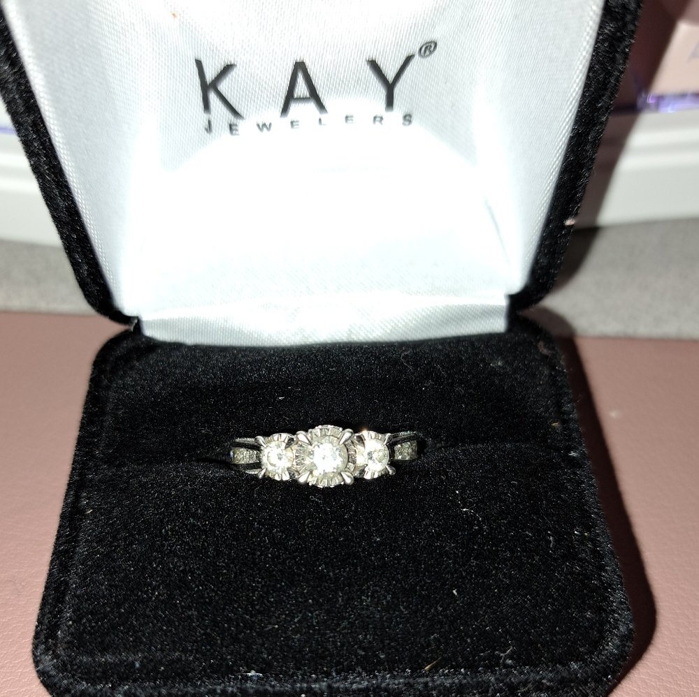 Three stone diamond engagement ring